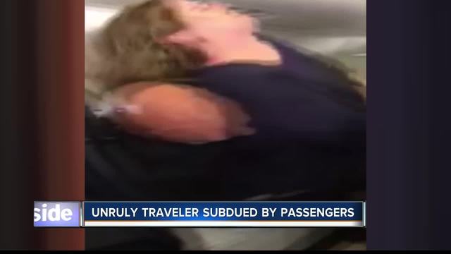 Flight lands after woman tries to open door in midair